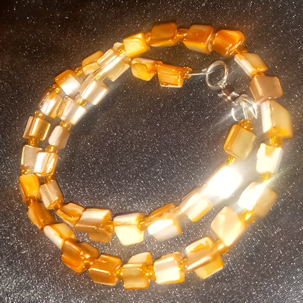 Natural mother of pearl coral color shell necklace. 18 inches long.